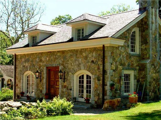 Traditional natural stone siding home