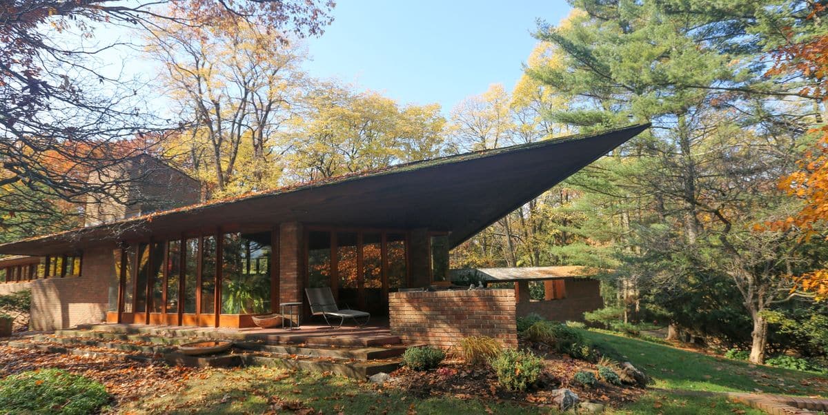 Frank Lloyd Wright modern designs including brick exterior, cedar siding and wooden window trim